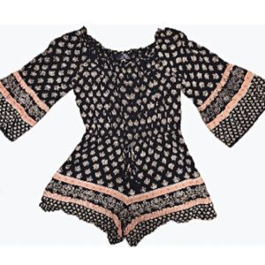 Francesca’s Blue Rain Navy and pink wide legged romper, size M.